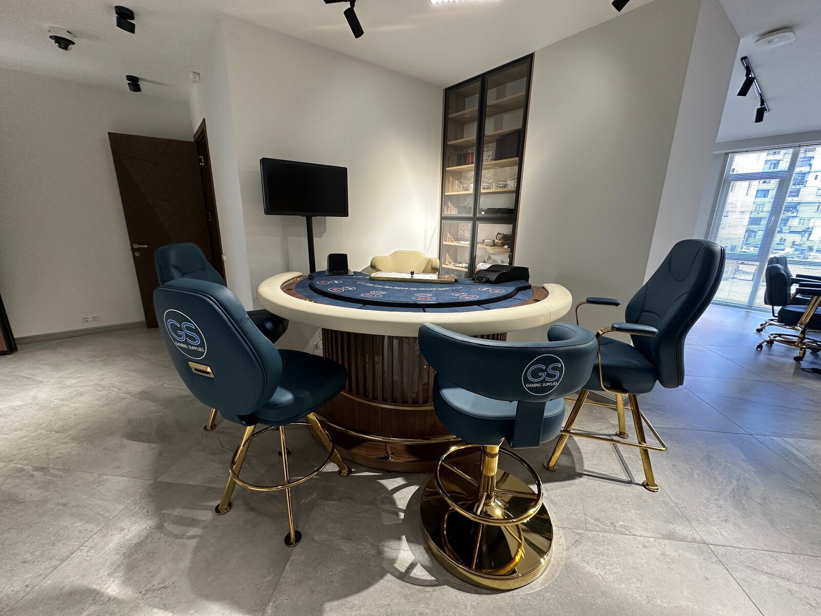 Gaming Supplies Batumi showroom with a casino poker table and GS-branded chairs